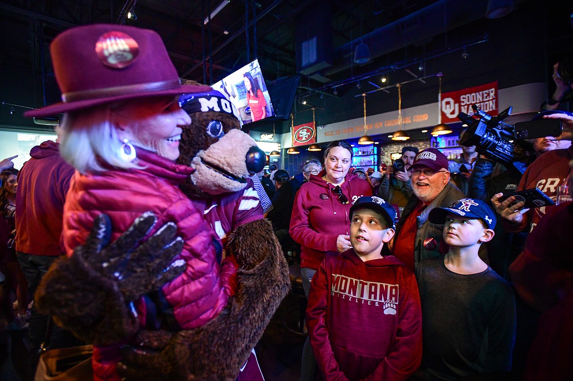 Monte takes photos with fans during a Griz Gathering held at Frisco Bar & Grill in Frisco, Texas, on Friday, Jan. 5. (Casey Kreider/Daily Inter Lake)