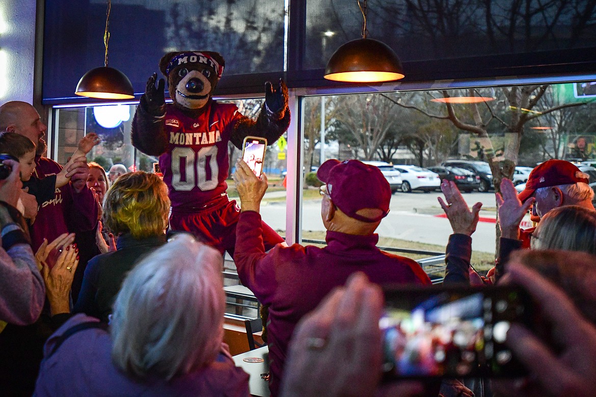 Monte takes photos with fans during a Griz Gathering held at Frisco Bar & Grill in Frisco, Texas, on Friday, Jan. 5. (Casey Kreider/Daily Inter Lake)