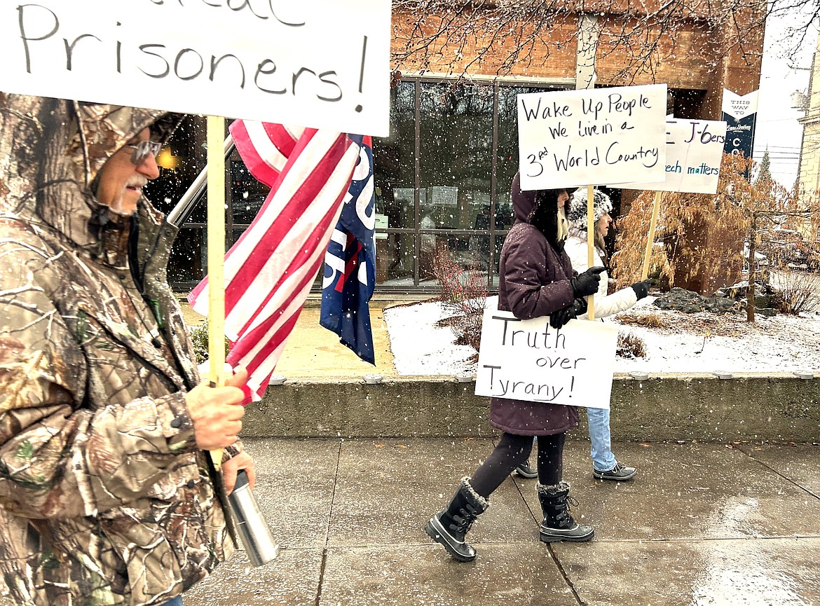 People rally on Saturday in downtown Coeur d'Alene on the third anniversary of the Jan. 6, 2021 event at the Capitol.