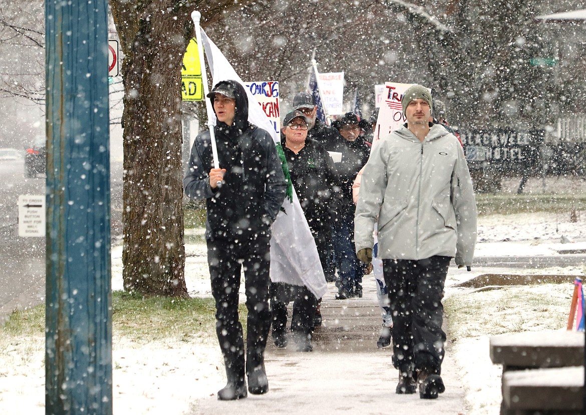 Kyle Storm, left, and Drew Cummings lead a "Justice for J6ers" rally in Coeur d'Alene on Saturday.