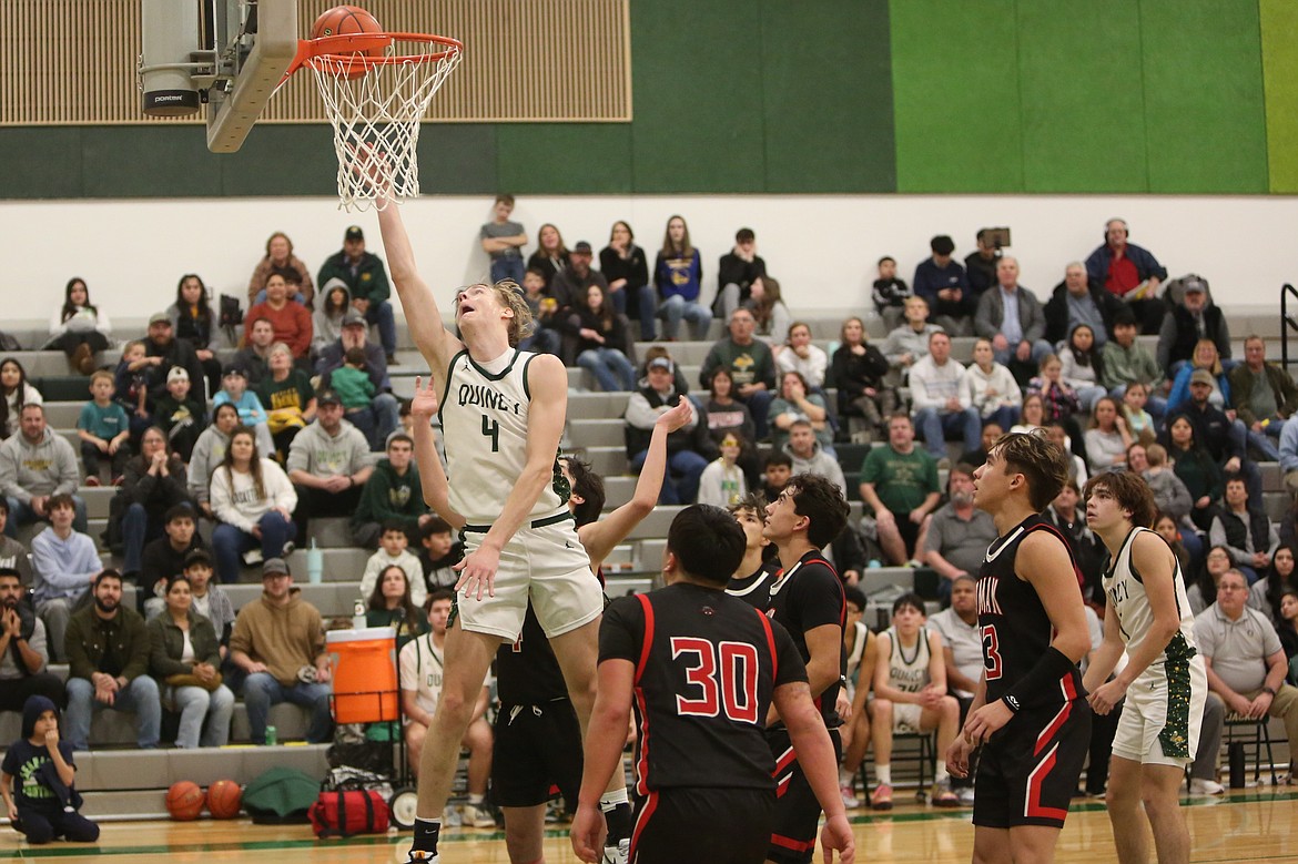 Quincy senior Aidan Bews (4) scored his 1000th point in the Jackrabbits’ 60-49 win over Omak on Friday.