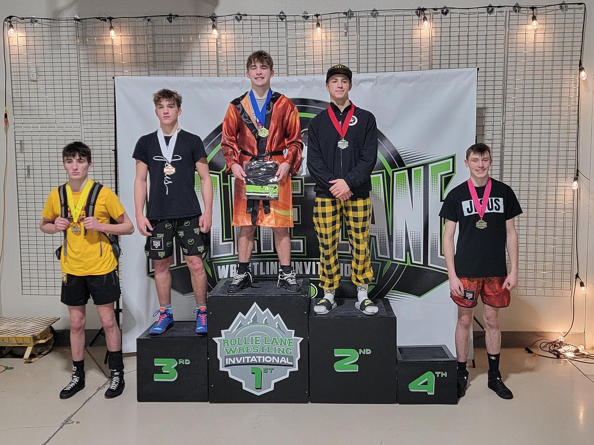 Priest River's Caeden McLaimtaig (far right) stands on the podium with his sixth-place medal from the Rollie Lane Wrestling Invitational held Friday and Saturday at the Ford Idaho Center in Nampa.