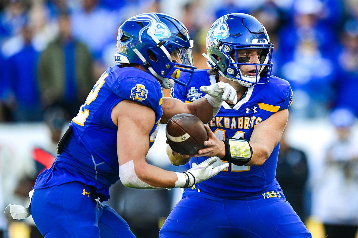 South Dakota State quarterback Mark Gronowski (11) hands off the running back Isaiah Davis (22) in the first quarter against Montana in the FCS National Championship at Toyota Stadium in Frisco, Texas on Sunday, Jan. 7. (Casey Kreider/Daily Inter Lake)