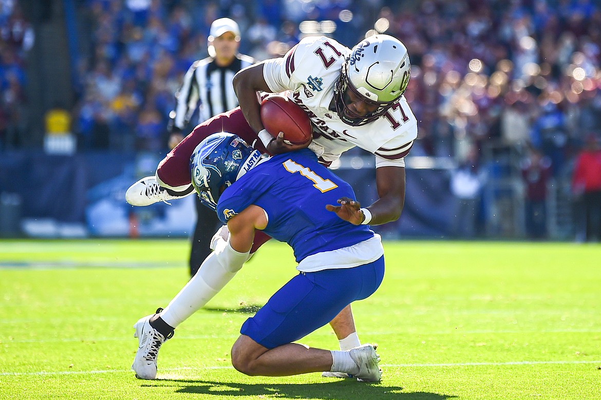 Grizzlies quarterback Clifton McDowell (17) is stopped by South Dakota State safety Tucker Large (1) on a run in the first quarter of the FCS National Championship at Toyota Stadium in Frisco, Texas on Sunday, Jan. 7. (Casey Kreider/Daily Inter Lake)