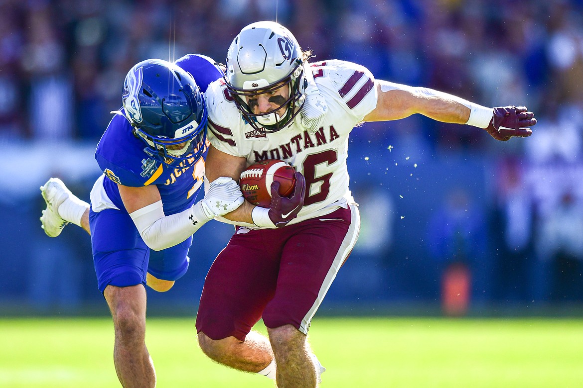 Grizzlies running back Nick Ostmo (26) is brought down by South Dakota State safety Tucker Large (1) in the first quarter of the FCS National Championship at Toyota Stadium in Frisco, Texas on Sunday, Jan. 7. (Casey Kreider/Daily Inter Lake)