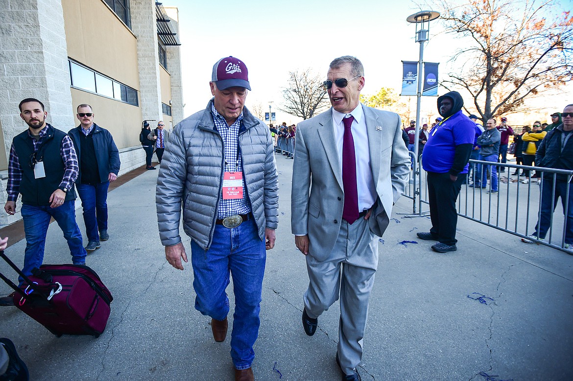 Grizzlies head coach Bobby Hauck, right, speaks with Montana governor Greg Gianforte as they enter the stadium before the FCS National Championship against the South Dakota State Jackrabbits at Toyota Stadium in Frisco, Texas on Sunday, Jan. 7. (Casey Kreider/Daily Inter Lake)