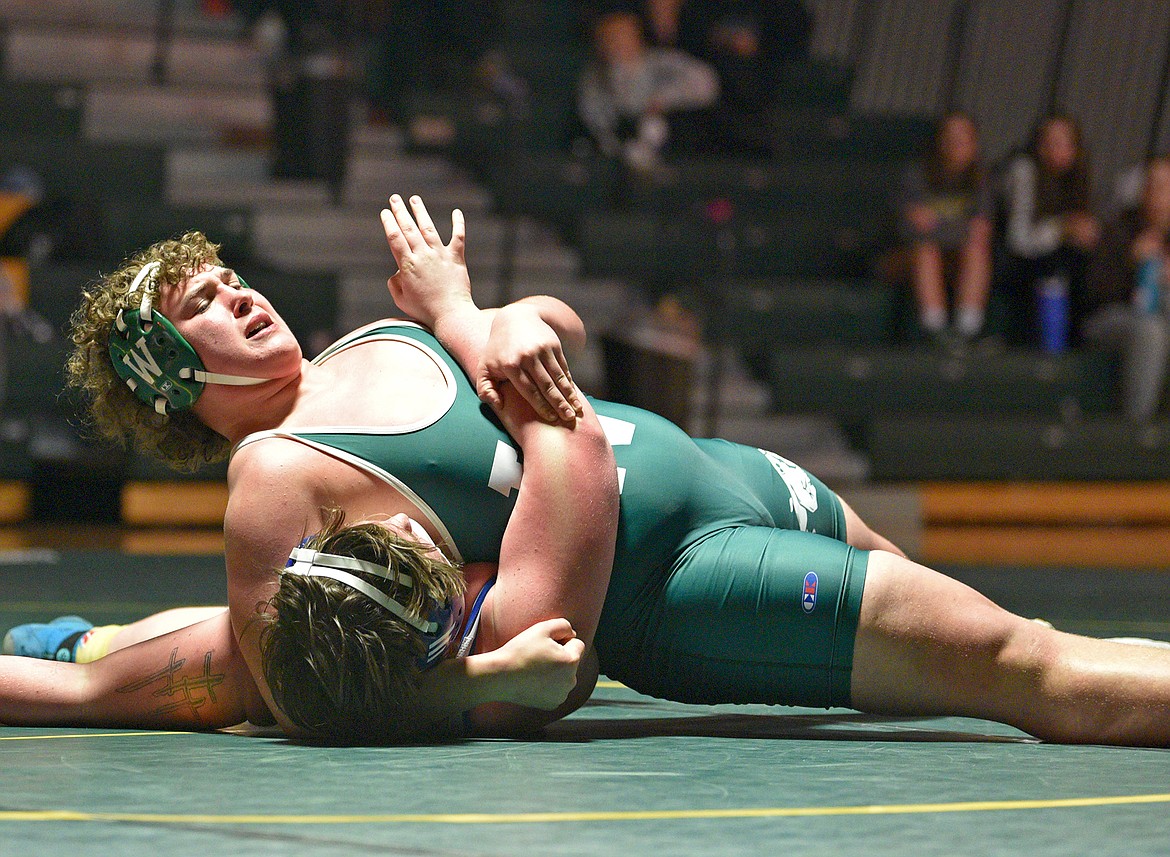 Whitefish heavyweight wrestler Sam Akey pins his opponent during a match against Libby on Thursday, Jan. 4, 2024 in Whitefish. (Whitney England/Whitefish Pilot)