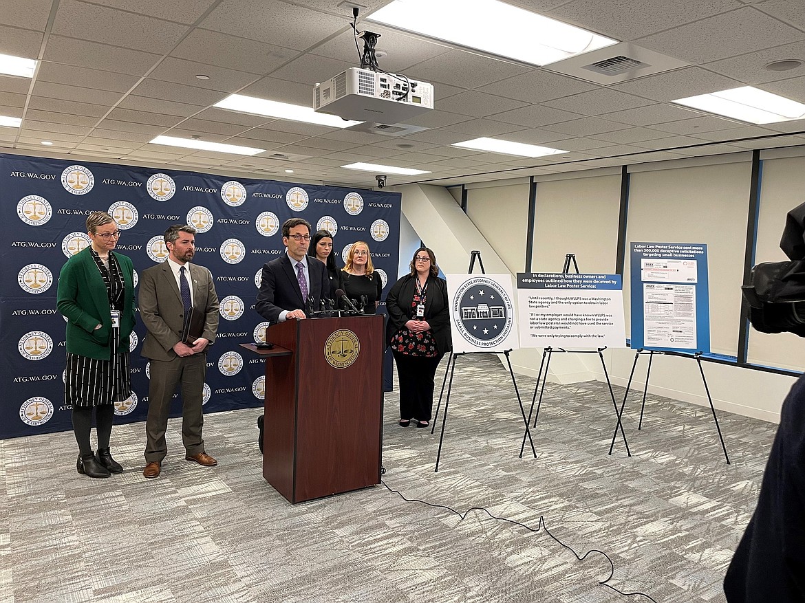 Washington Attorney General Bob Ferguson speaks during a press conference Monday regarding fraudulent mailers sent to Washington businesses.