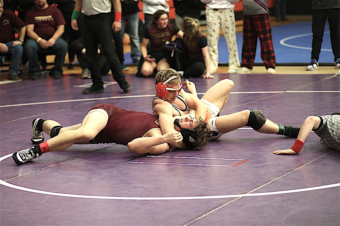 Landon Bishop gets another pin for the Chiefs during last weekend's tournament in Ronan. (Susan Lake photo)