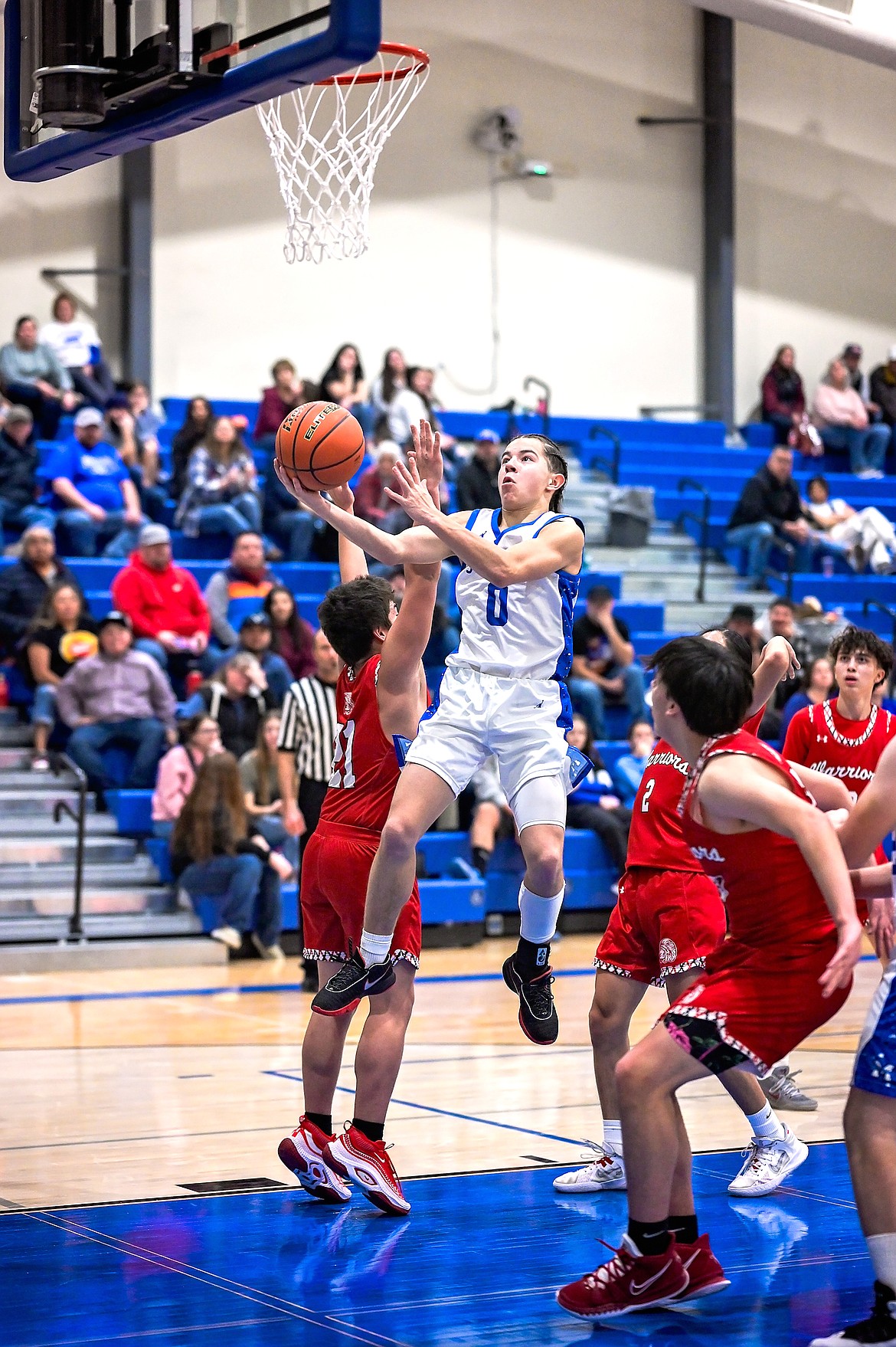 Bulldog Lex Lafrombois hangs mid-air amid a pack of Warriors. (Christa Umphrey photo)