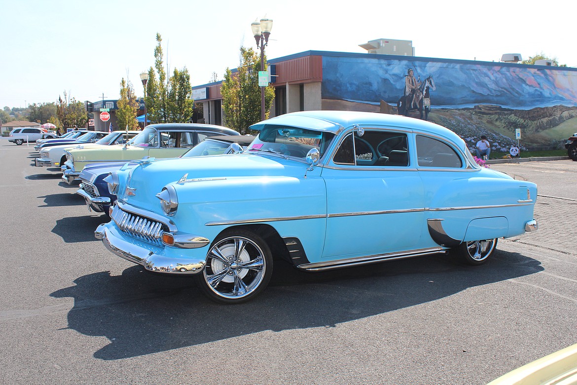 Cars line the street at the MLCCC show at the 2023 Sip ‘n Stroll in September.