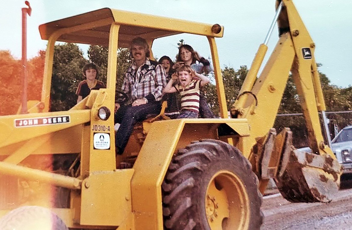 McGough gives some kids a ride on an excavator. (Photo provided)