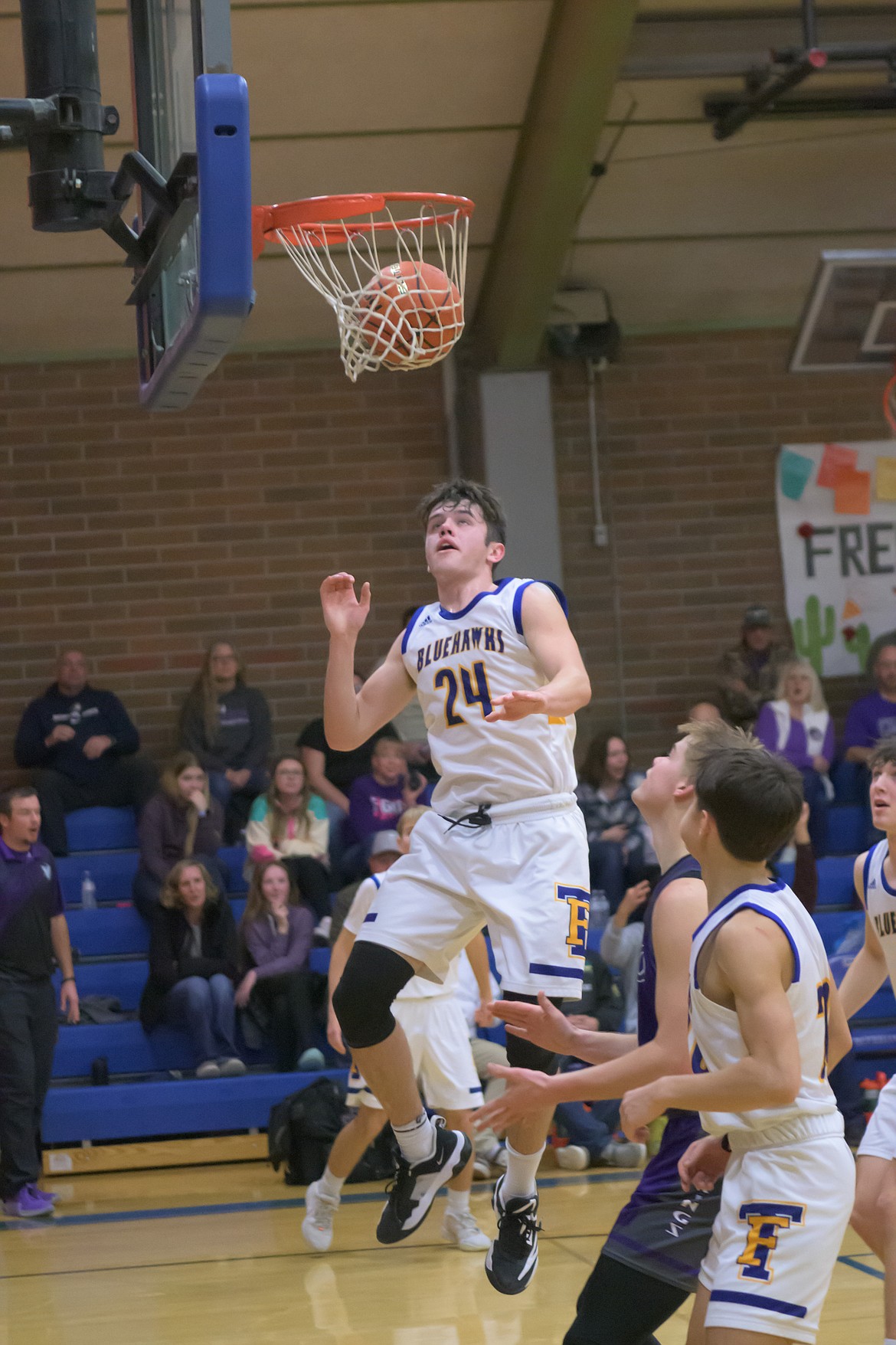 Thompson Falls's Braedon Ferris (24) watches as two of his points tickle the twines during the Hawks game with Charlo Saturday evening in T Falls.  (Photo by Tracy Scott)