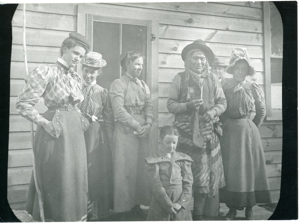 A group of people stand at the University of Montana Biological Station, on Flathead Lake, about 1906. Chief Michelle, of the Pend d'Oreille on the Flathead Reservation, is second from the right. Morton J. Elrod, the biological station's founder, took the photo. (Photo courtesy of the Northwest Montana History Museum)