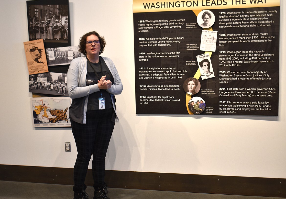 Moses Lake Museum & Art Center director Dollie Boyd describes a display showcasing the road to universal suffrage in Washington, part of the “Ahead of the Curve” exhibit opening Friday.