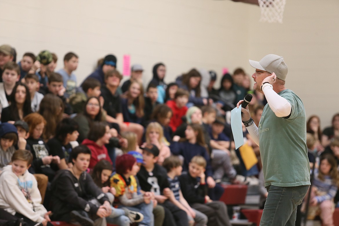 Ovation Company founder Stu Cabe listens for a response from Lakes Middle School sixth graders Tuesday during Connecting the Dots, a program to improve student relationships and school culture. Seventh grade will participate today.