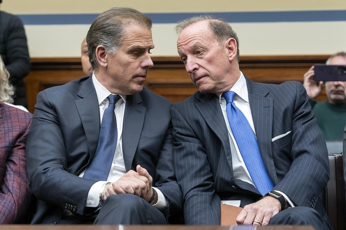 Hunter Biden, President Joe Biden's son, accompanied by his attorney Abbe Lowell, sits in the front row at a House Oversight Committee hearing as Republicans are taking the first step toward holding him in contempt of Congress, Wednesday, Jan. 10, 2024, on Capitol Hill in Washington. (AP Photo/Jose Luis Magana)