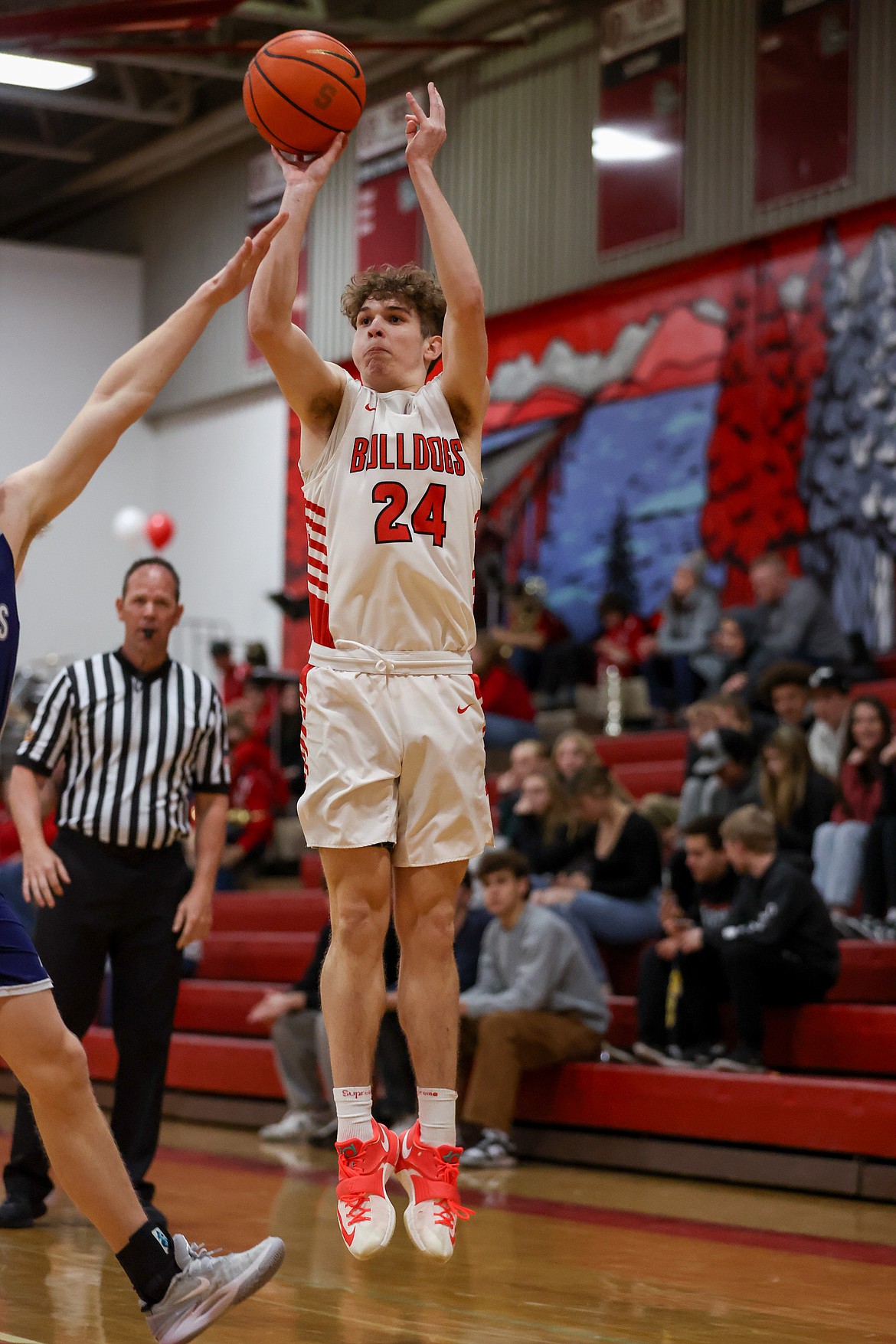 Sandpoint senior Parker Childs shoots from beyond the arc at Les Rogers Court  Wednesday. Childs scored a team-high 21 points on the night for the Bulldogs.