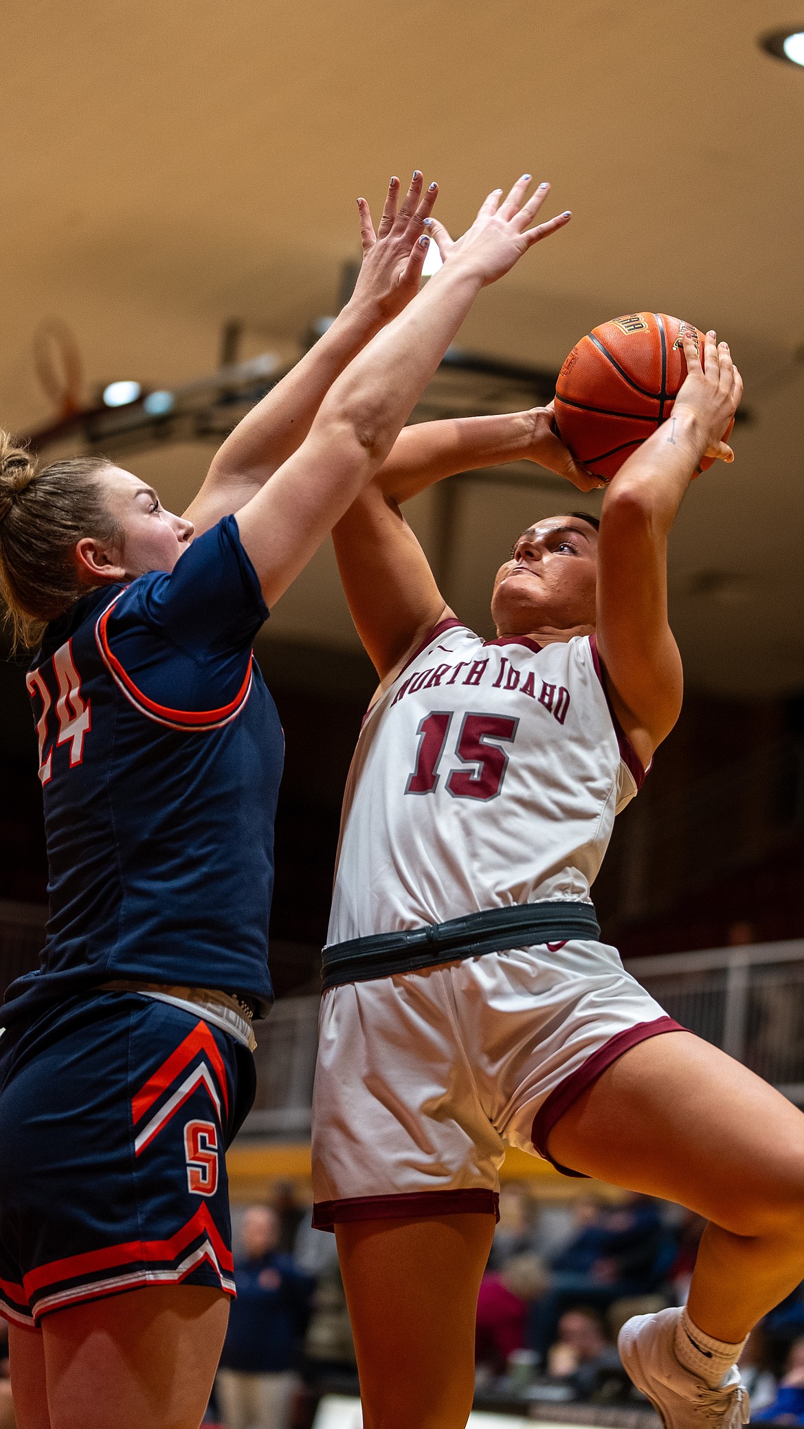 NORTH IDAHO COLLEGE ATHLETICS
North Idaho College guard Maddie Williamson attempts to shoot over Snow's Ainsley Thurber in the third quarter of Wednesday's Scenic West Athletic Conference game at Rolly Williams Court.