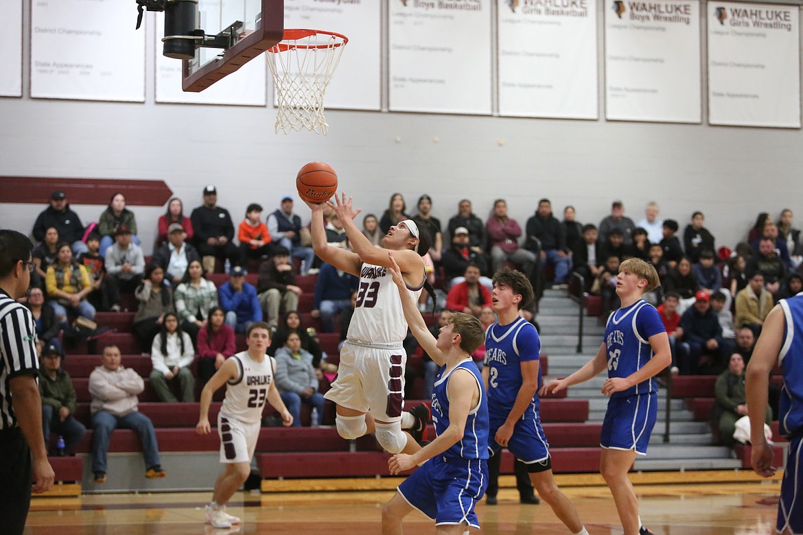 Wahluke senior Jordan Buck (33) gives the Warriors the lead in the third quarter against Kiona-Benton Tuesday.