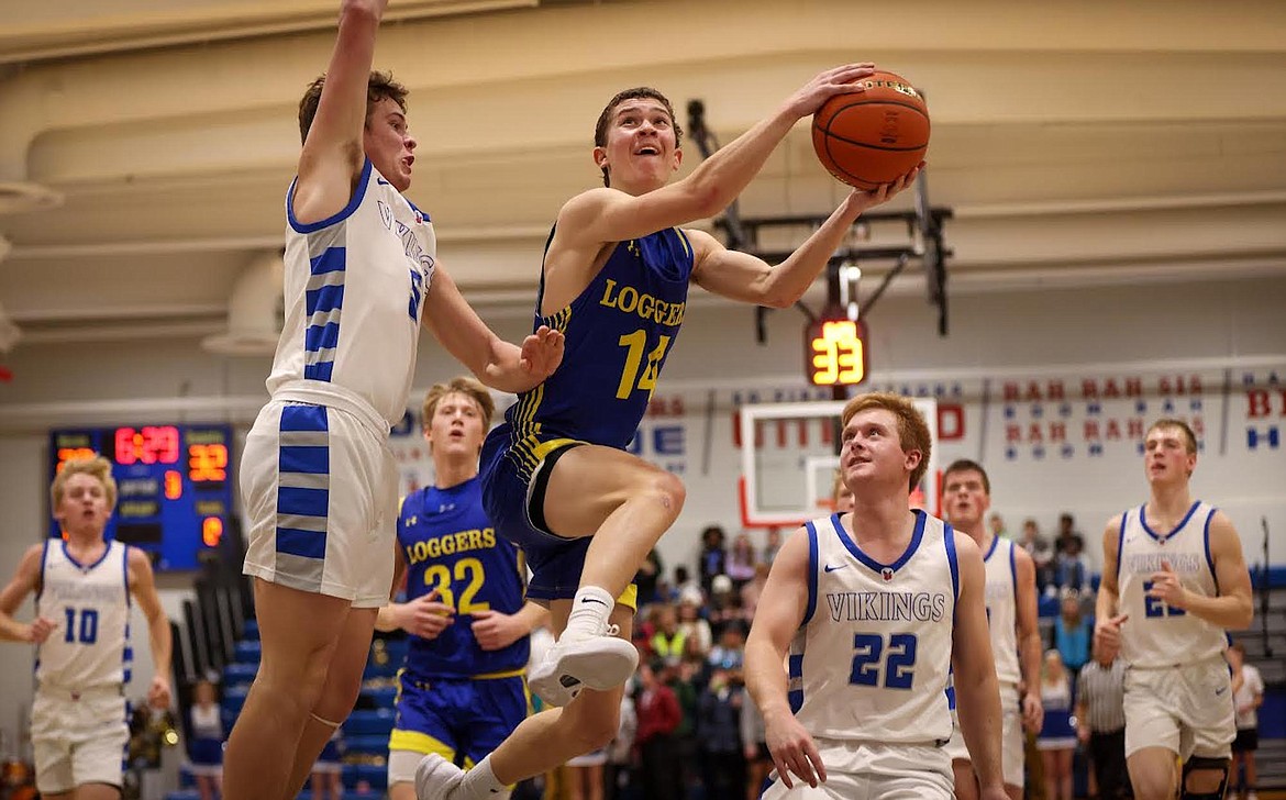 Libby's Tyler Andersen heads to the basket against Bigfork on Jan. 4, 2024. (Jeremy Weber/Bigfork Eagle)