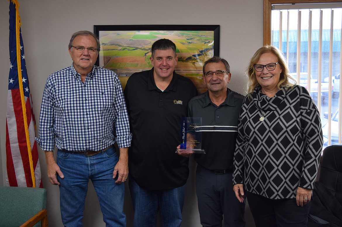 The outgoing Port of Othello Commissioner Kenny Schute was honored at the port’s last meeting in December. Pictured from left to right are Commissioner Gary Weaver, Executive Director Chris Faix, Commissioner Kenny Schute and Commissioner Deena Vietzke.