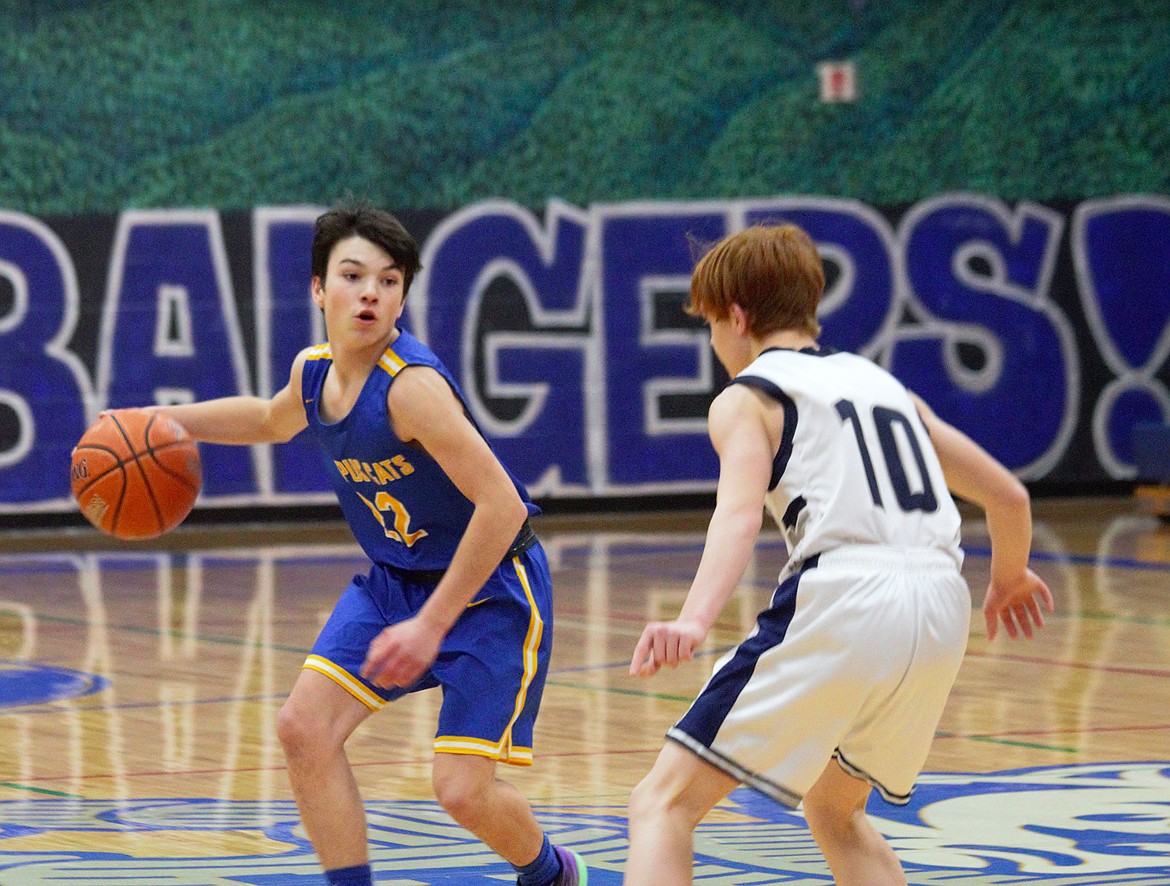 Clark Fork's Buddy Adams dribbles down the court while guarded by Myles Stanger of Bonners Ferry on Friday.