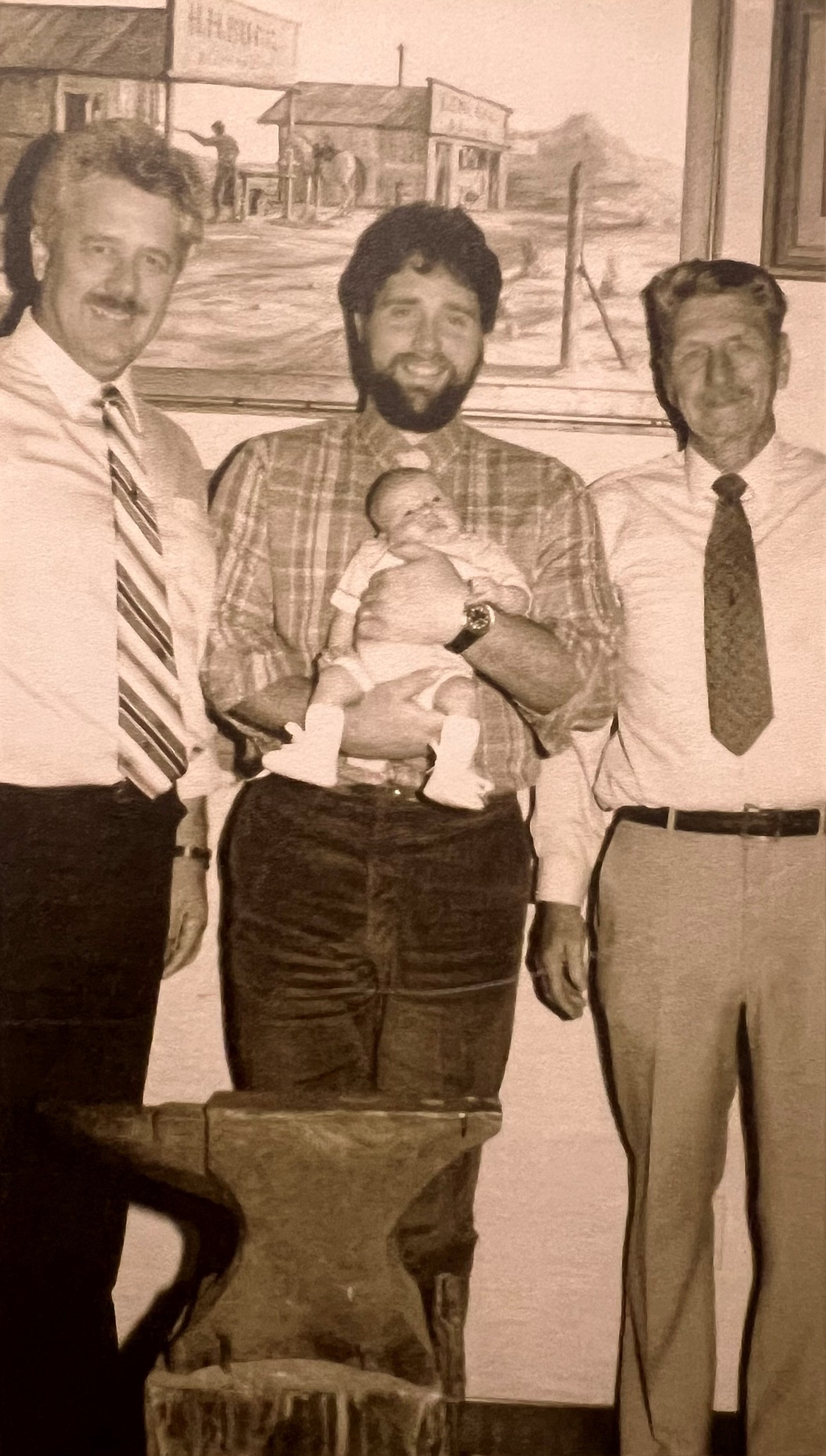 Four generations of Bucks are seen at the Buck factory in El Cajon, Calif., in 1986. From left: Chuck Buck, current Chairman and CEO CJ Buck holding baby son Josh Buck and Al Buck.