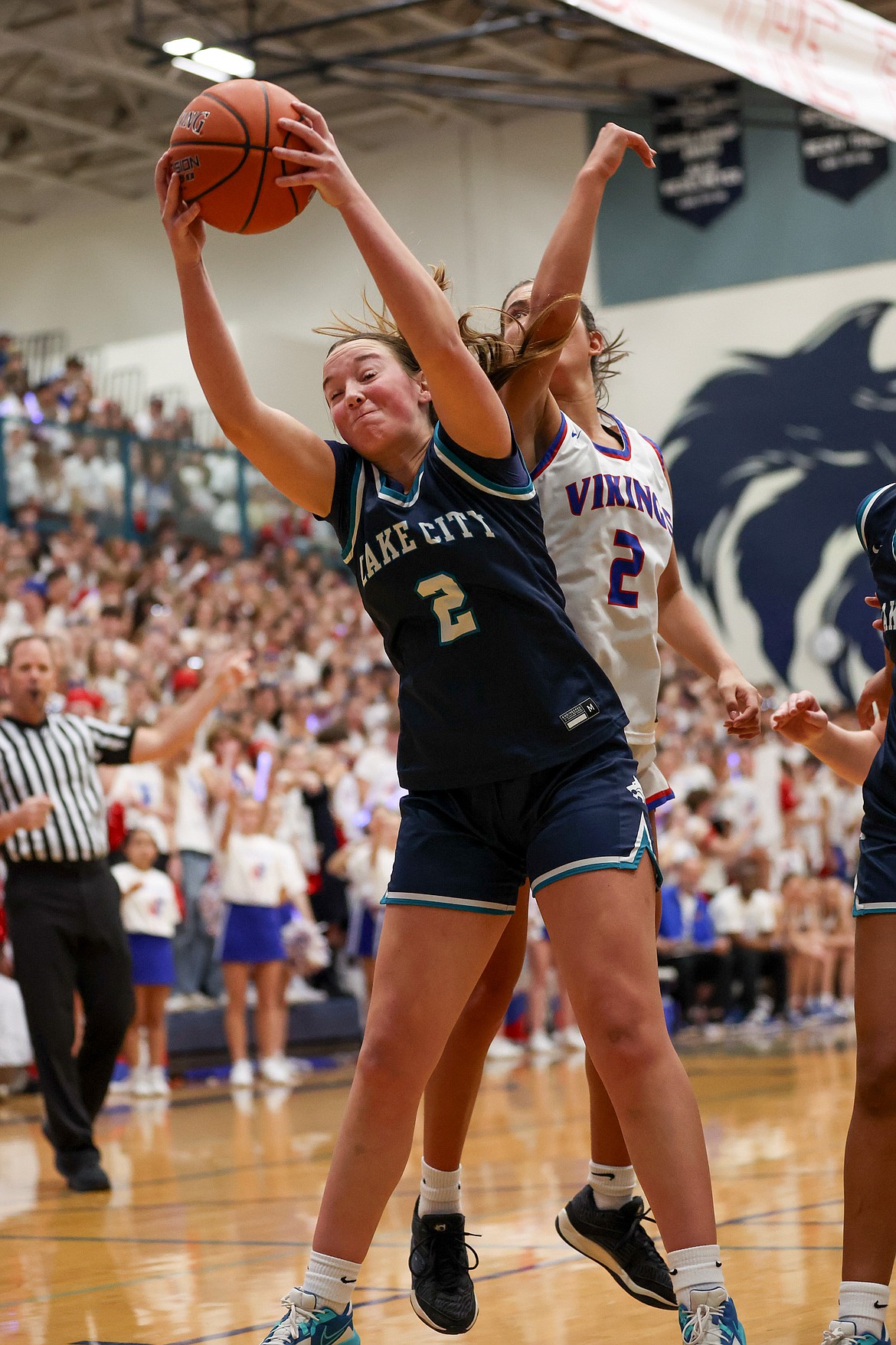 JASON DUCHOW PHOTOGRAPHY
Senior Kamryn Pickford (2) of Lake City grabs a rebound as senior Madison Mitchell (2) of Coeur d'Alene challenges in the Fight for the Fish game Friday night at Lake City High.