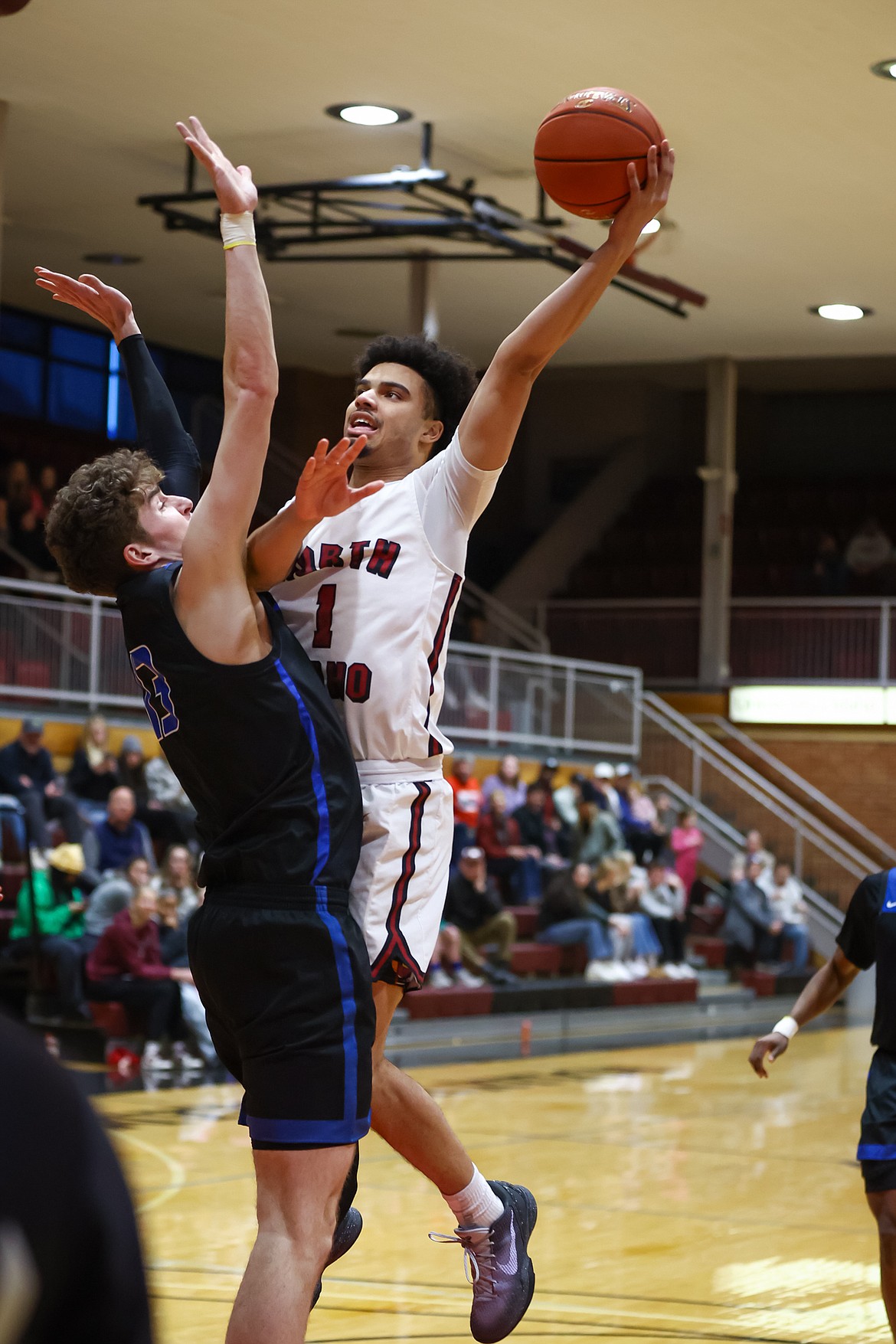 KYLE DISHAW PHOTOGRAPHY
North Idaho College guard Austin Johnson drives to the basket on Salt Lake defender Preston Squire during the second half of Saturday's Scenic West Athletic Conference game at Rolly Williams Court.