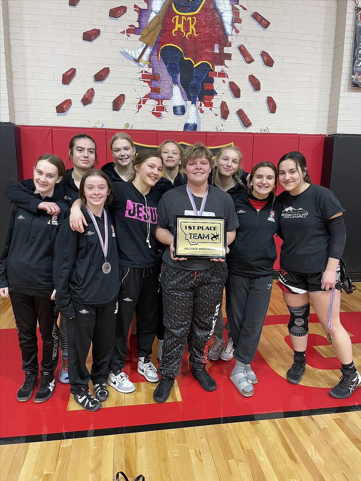 Courtesy photo
The Sandpoint girls wrestling team holds up the championship trophy from the Hellgate Girls Invitational held at Hellgate High this Friday and Saturday. In the front row from left are Mackenzee Donenfeld, Emma Garman, Lilli Marti, Izzy Stark, and Sylvia Becker; and back row from left, Jean Marshall, Kaysha Kimura, Emma Hilton, Hunter Edmondson and Jaya Rosenau.