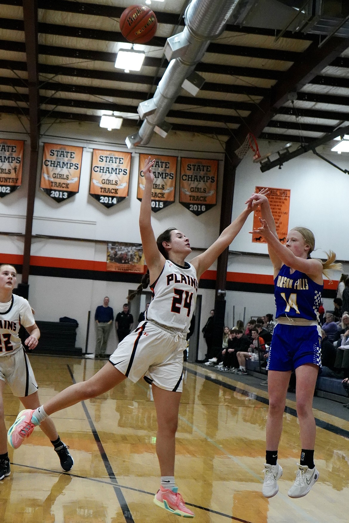 Thompson Falls freshman Addy Deal shoots over Plains' Katelyn Subatch during their game this past Thursday night in Plains.  Deal had 11 points for the Lady Hawks. (Courtesy photo)