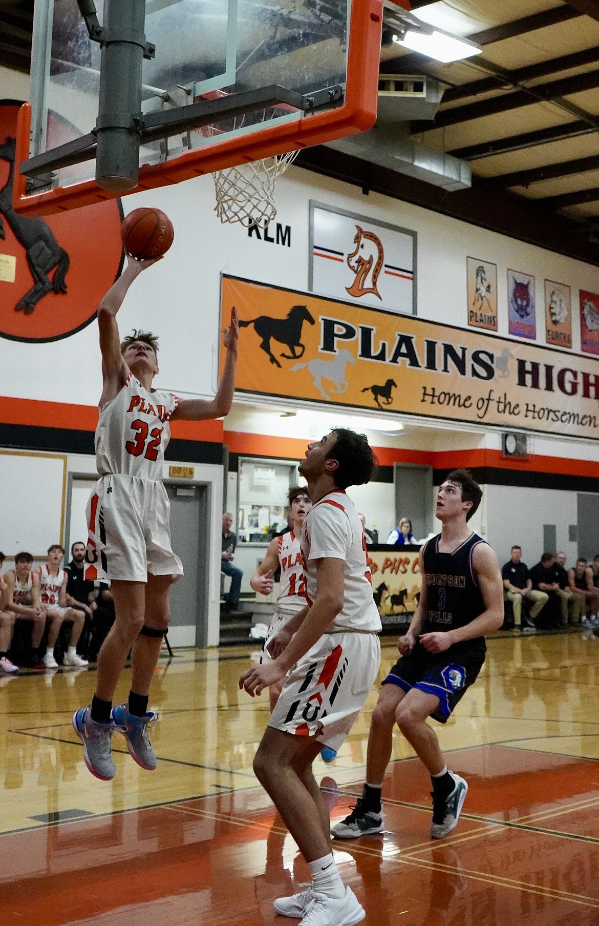 Plains forward Zayden Allen (32) goes up for two under the watchful eye of teammate Anaya Lobert (34) during the Horsemen's game with Thompson Falls this past Thursday in Plains. (Courtesy photo)