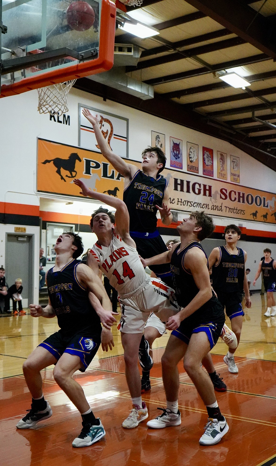 T Falls junior Braedon Ferris rises above the pack to deliver two points during the Blue Hawks win over Plains this past Thursday in Plains. (Courtesy photo)