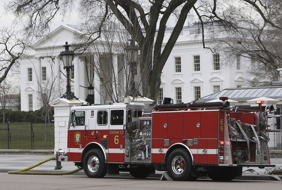 A firetruck is parked outside of the White House in Washington, Dec. 19, 2007. A fake 911 call that the White House was on fire sent emergency vehicles to the complex Monday morning. President Joe Biden and his family were at Camp David at the time. (AP Photo/Ron Edmonds, File)