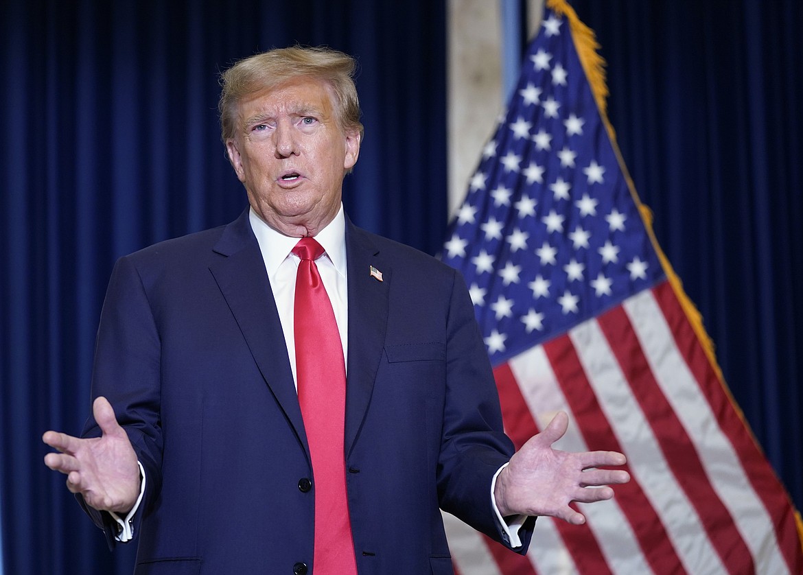 Former President and current presidential candidate Donald Trump speaks to the media at a Washington D.C. hotel on January 9. Washington has joined a list of several states examining his eligibility to be on the ballot under the 14th Amendment.