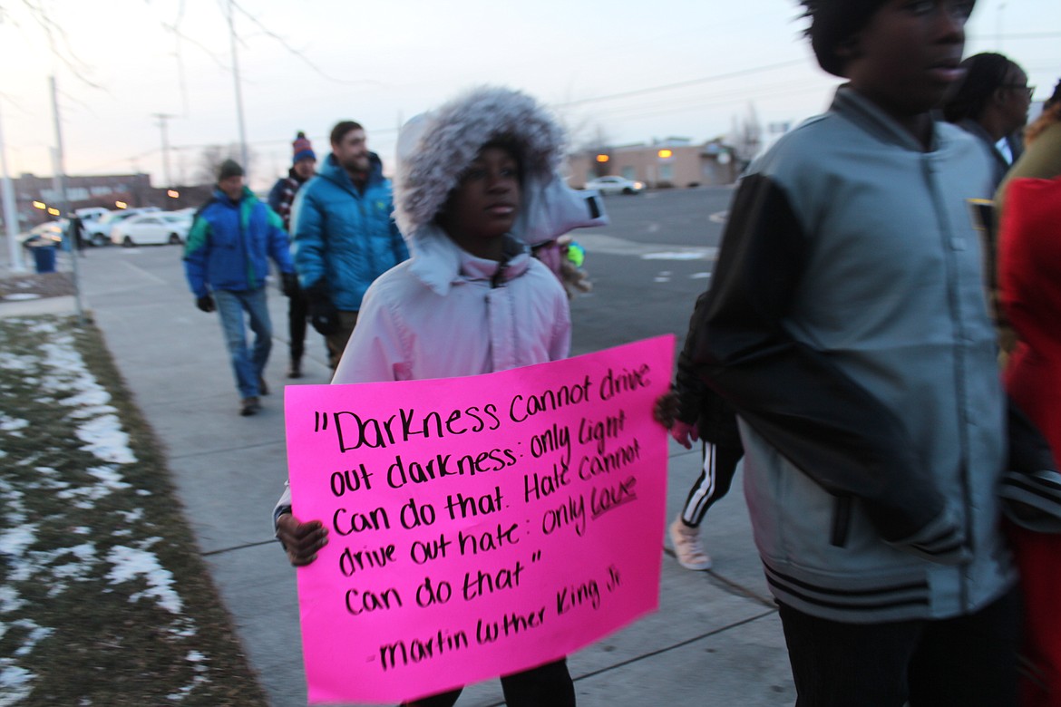 Marchers walked down Fourth Avenue carrying signs with quotes from the civil rights leader.