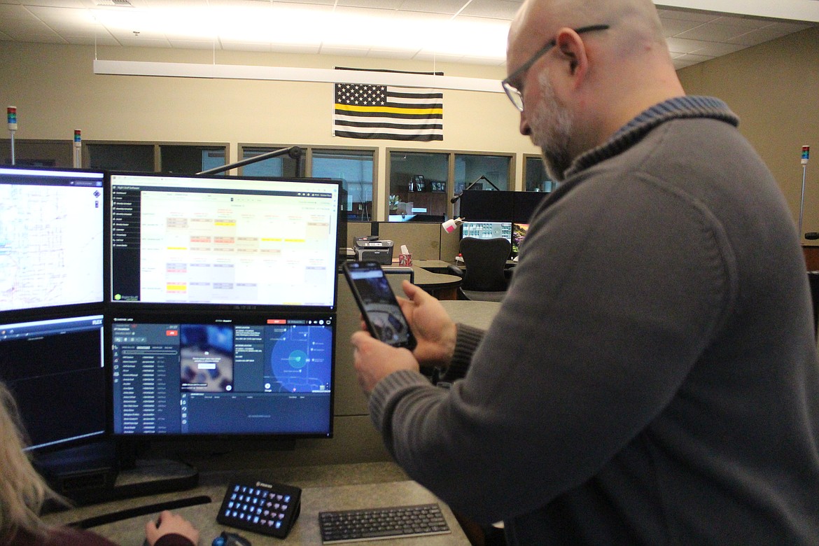 Multi-Agency Communications Director D.T. Donaldson sends video directly to the computer of a MACC dispatcher. Video capability is one of the technology upgrades being installed at the dispatch center.