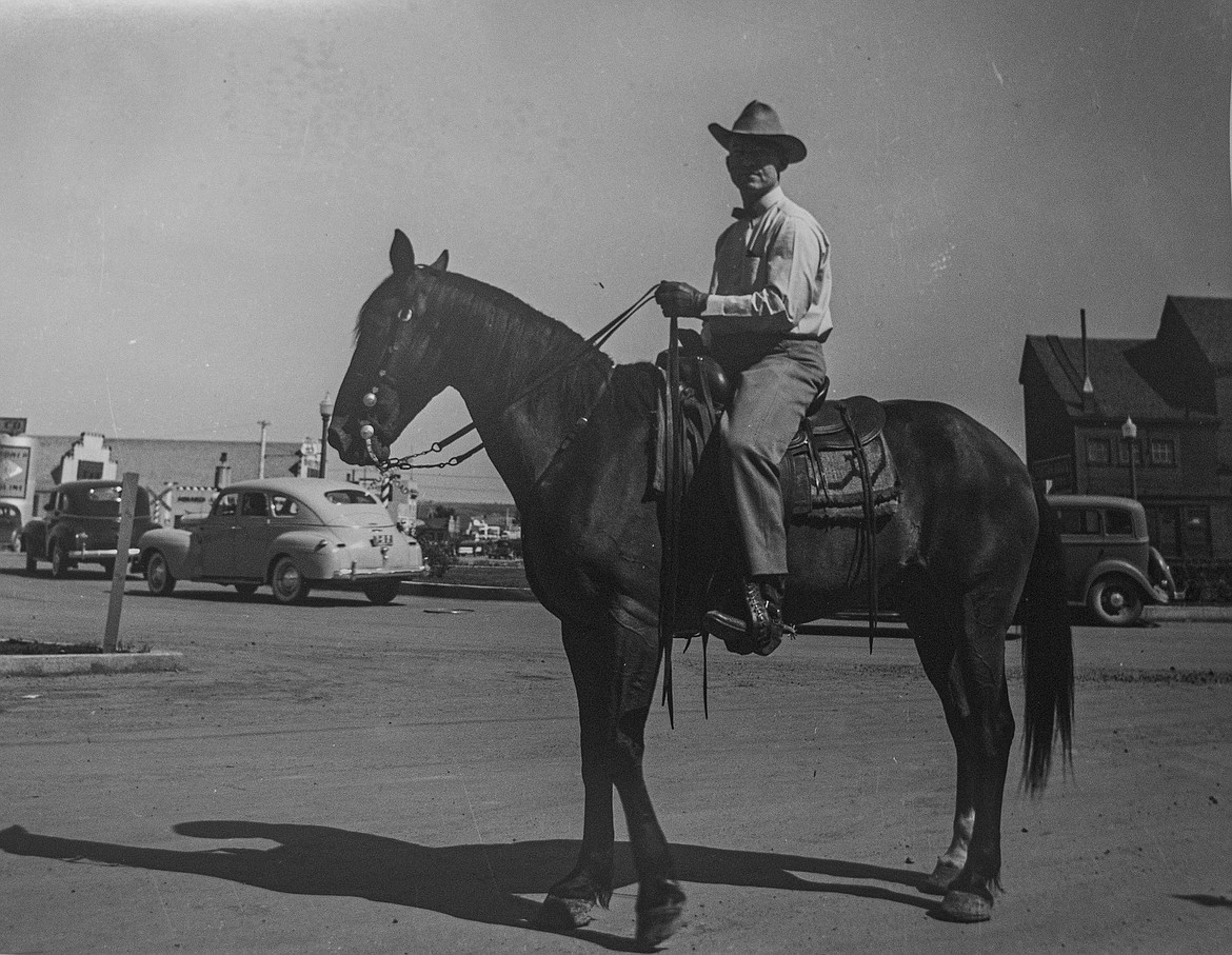 Attorney Forrest Rockwood astride purebred Morgan horse in Kalispell, circa 1945. Photo by Raymond "Ray" Weaver. Some of Weaver's photos, which depicted everyday life, will be on display at the Northwest Montana History Museum in Kalispell through the winter months. (Photo by Ray Weaver)