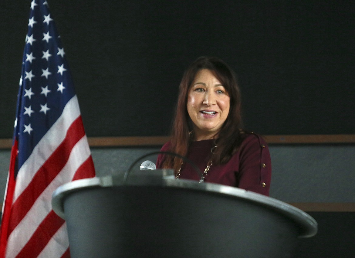 Cindy Jordan, president of the Post Falls Chamber's board of directors, speaks to chamber members and guests Tuesday during a luncheon at the Club at Prairie Falls.