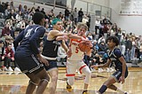 PREP BOYS BASKETBALL: Vikings win one on the move