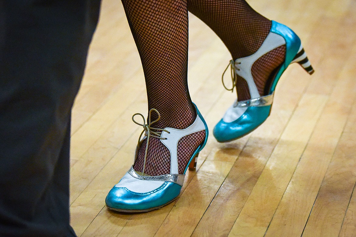 Kim Davie dances the Argentine tango in her teal-accented tango shoes at a Kalipsell Tango class at the Kalispell Senior Center on Tuesday, Jan. 16. (Casey Kreider/Daily Inter Lake)