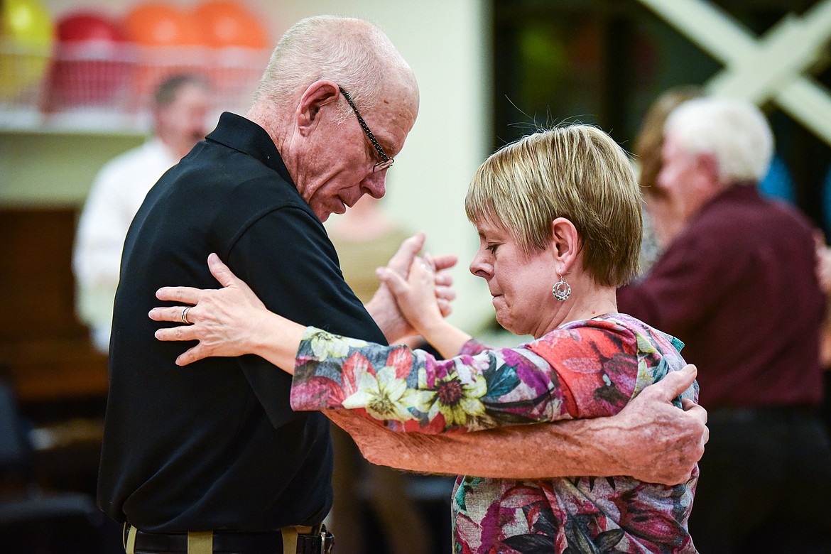 Dan Harp watches his footing as he practices the Argentine tango with Lee Anne Byrne at a Kalipsell Tango class at the Kalispell Senior Center on Tuesday, Jan. 16. (Casey Kreider/Daily Inter Lake)