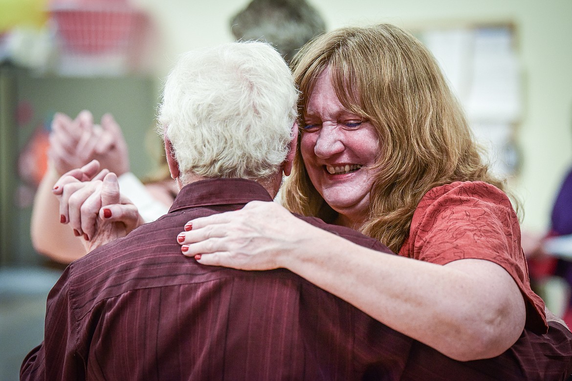 Dwight Bergeron and Robin Werre share a laugh while dancing the Argentine tango at a Kalipsell Tango class at the Kalispell Senior Center on Tuesday, Jan. 16. (Casey Kreider/Daily Inter Lake)