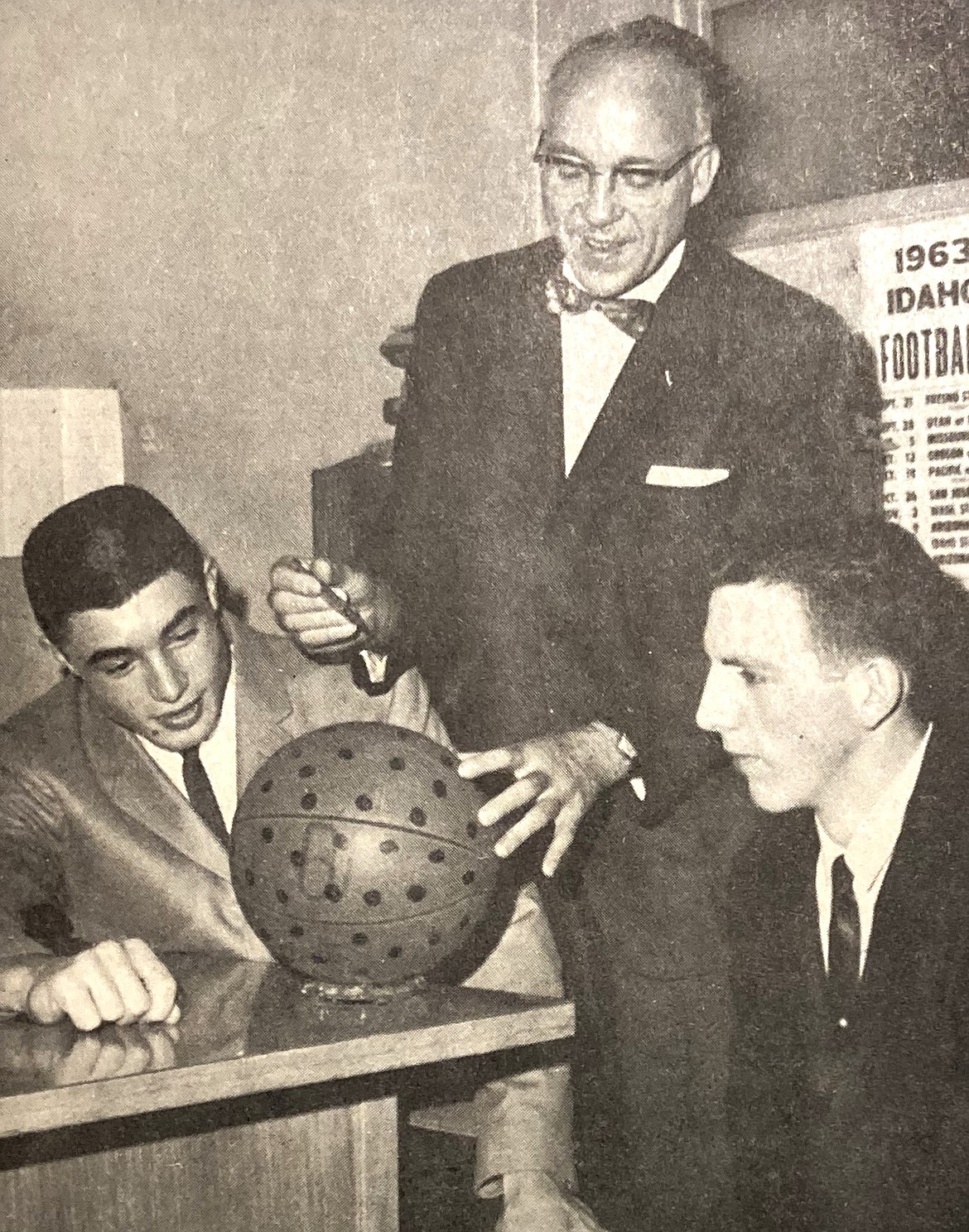 In January 1964, Dr. “Ted” Fox pretended to inoculate a spot-marked basketball against measles as CHS Viks Bob Pegg, left, and Don Barnes watched.