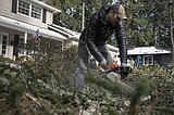 Stay off the roads, Pacific Northwest residents are told as ice storm coats roads and trees