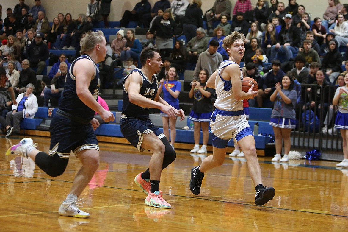 Soap Lake junior Ruvium Goloborodko, in white, led the Eagles with 23 points Tuesday against MLCA/CCS.