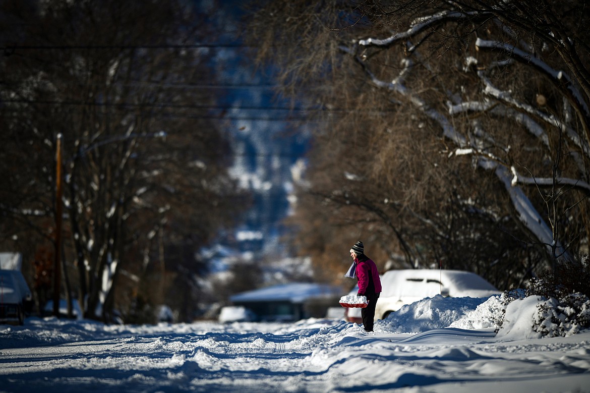 A resident of Fifth Street West shovels snow on Thursday, Jan. 18. (Casey Kreider/Daily Inter Lake)