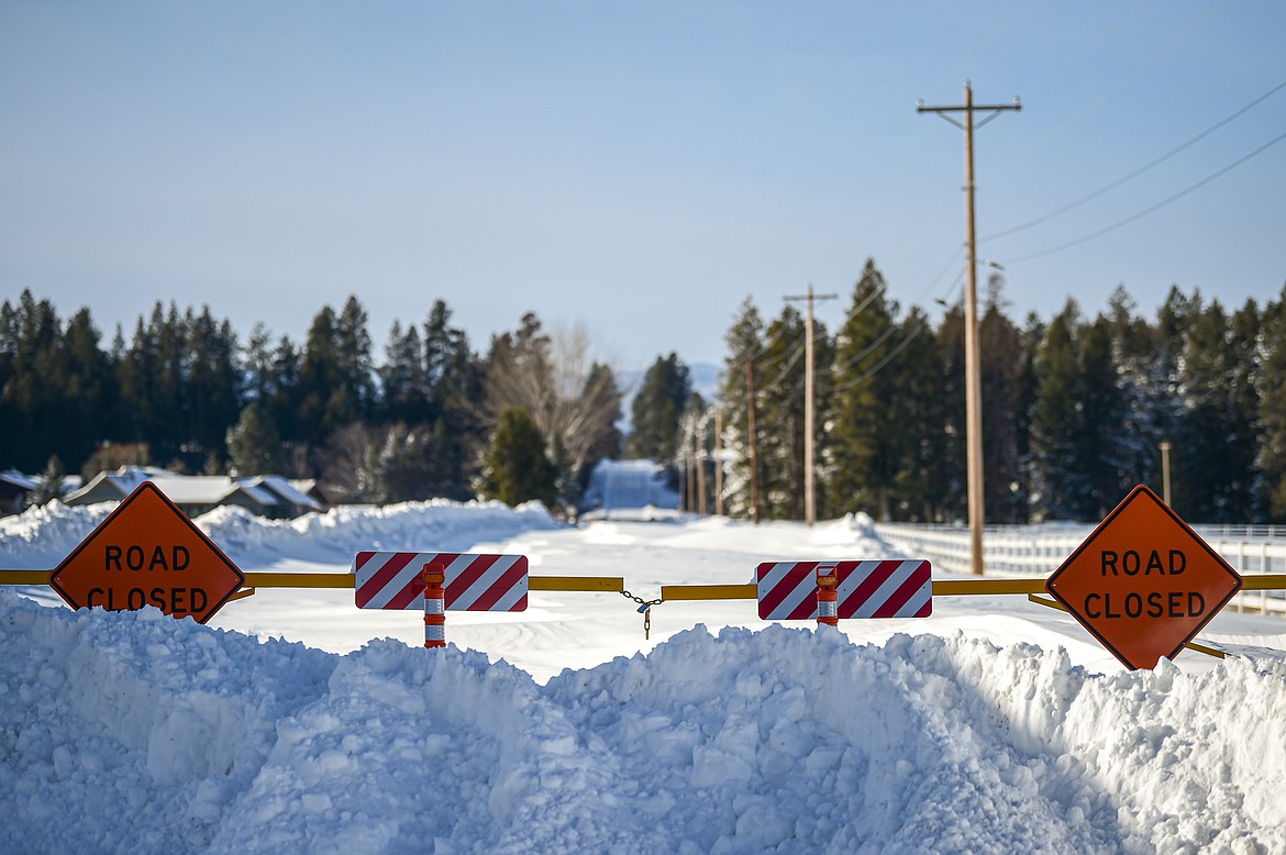 A closed gate with "Road Closed signs along Hodgson Road on Thursday, Jan. 18. (Casey Kreider/Daily Inter Lake)