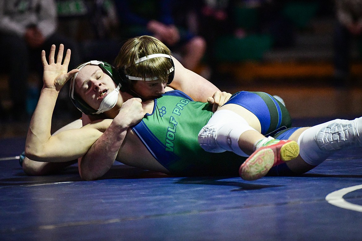 Flathead's Colton Kuka wrestles Glacier's Shannon Hughes at 160 lbs. at Glacier High School on Thursday, Jan. 18. (Casey Kreider/Daily Inter Lake)